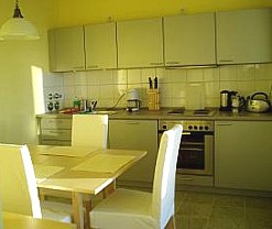 fitted kitchen with dining table