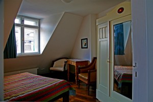 The bedroom with a large wardrobe, bed.